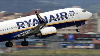 False fire alarm on Ryanair flight from Mallorca to Manchester causes emergency evacuation; 18 injured, six hospitalized. Authorities are investigating.