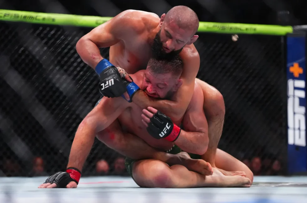 Khamzat Chimaev wins the UFC 319 title with 529 strikes, breaking a record and calling out Adesanya, Whittaker, and Strickland.